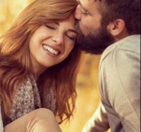 Smiling couple expressing trust and emotional closeness